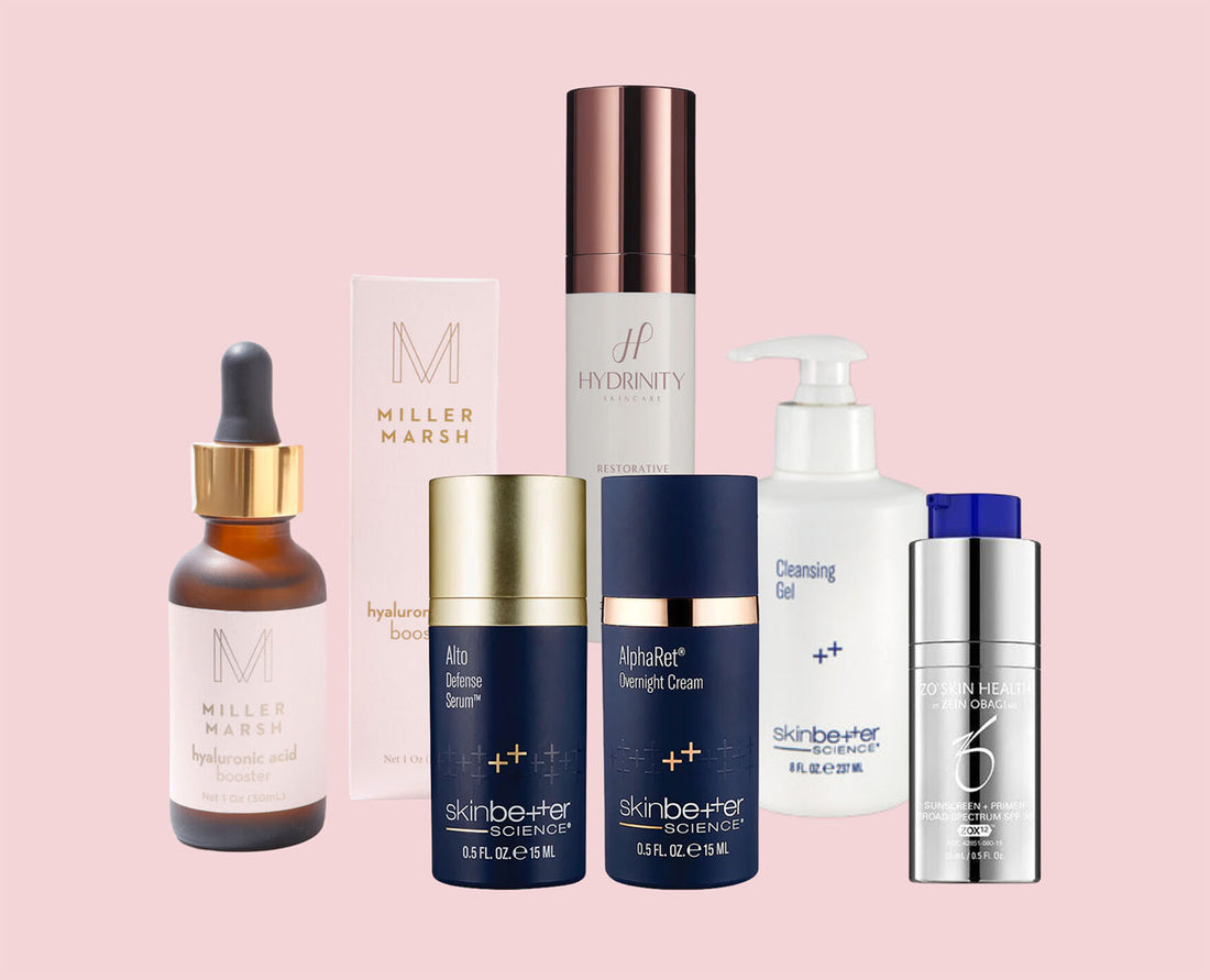 Group of skincare product bottles from Miller Marsh, SkinBetter, Hydrinity, and ZO Skin Health on a pink background